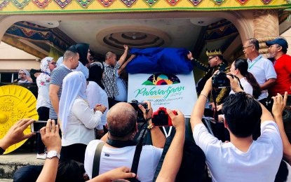 <p>PAKARADJAAN 2018. ARMM officials led by ARMM Environment Secretary Kahal Kedtag (right) and ARMM Boardmember Jazzer King Mangudadatu (left) launch Pakaradjaan 2018 in Buluan, Maguindanao on Monday. Similar launching were held on same day in other ARMM provinces of Basilan, Sulu, Tawi-tawi and Lanao del Sur. (Photo by DENR-ARMM)</p>